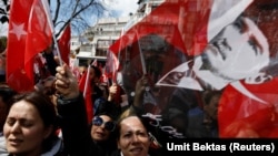 Supporters of the main opposition Republican People's Party wave portraits of Mustafa Kemal Ataturk. File photo