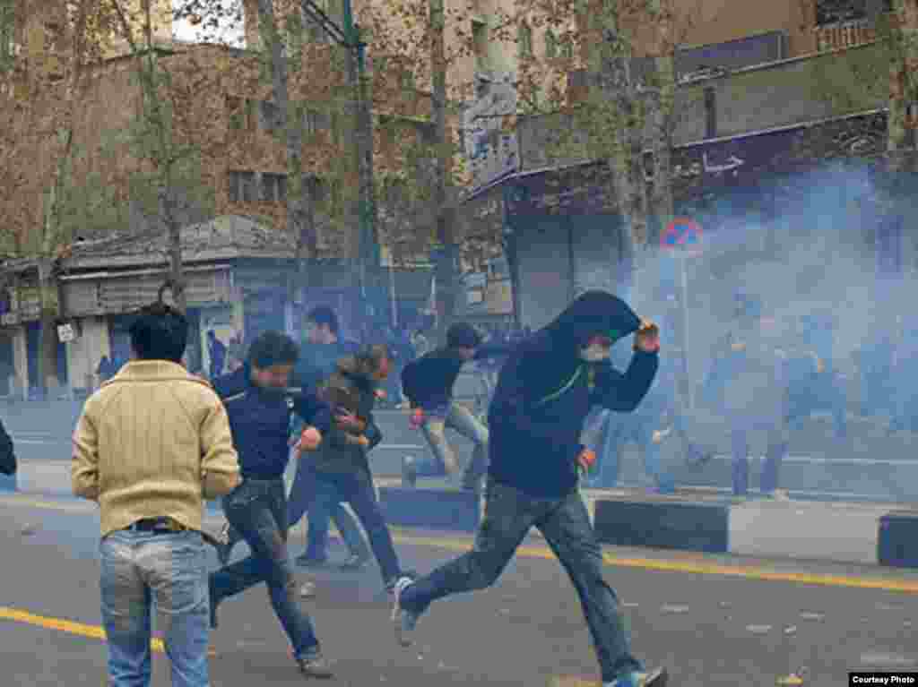 Iran -- Teargas is fired towards Iranian opposition supporters during clashes with security forces in Tehran on December 27, 2009. - Photo by Sara (Use only with Photographer's name