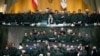 Iranian lawmakers in the April 9 parliament session wearing IRGC uniforms to show support for the military after it was listed the previous day as a terrorist outfit by the U.S.