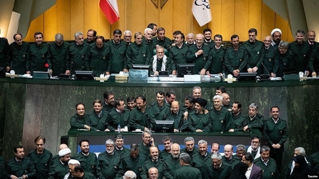 Iranian lawmakers in the April 9 parliament session wearing IRGC uniforms to show support for the military after it was listed the previous day as a terrorist outfit by the U.S.
