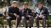 Men sit in a park in Stepanakert, the capital of Nagorno-Karabakh.