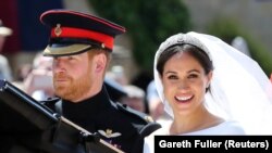 Британский принц Гарри и американская актриса Меган Маркл поженились в часовне Святого Георгия при Виндзорском замке, 19 мая 2018 года.