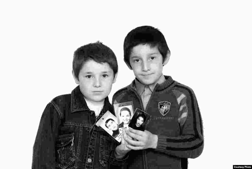 Timur (left) and Khetag Tamayev - These two brothers became orphans. Their entire family -- father, mother, and an older brother -- were killed in the siege. Eight-year-old Timur and 9-year-old Khetag remember only a little about them. Since they were small, their parents, Artur and Inga, left them at home with relatives on September 1, 2004. Their brother, Totraz, was starting first grade. Artur was killed during the first day of the siege. Inga and Totraz died on the last day. Timur and Khetag are being raised by their paternal grandmother.