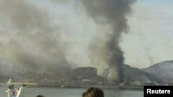 Smoke rises from South Korea's Yeonpyeong Island after it was hit by dozens of artillery shells. 