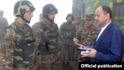 Armenia - Defense Minister Seyran Ohanian (R) awards soldiers on frontline duty.