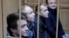 Богдан Небилиця і ще троє українських моряків у російському суді.