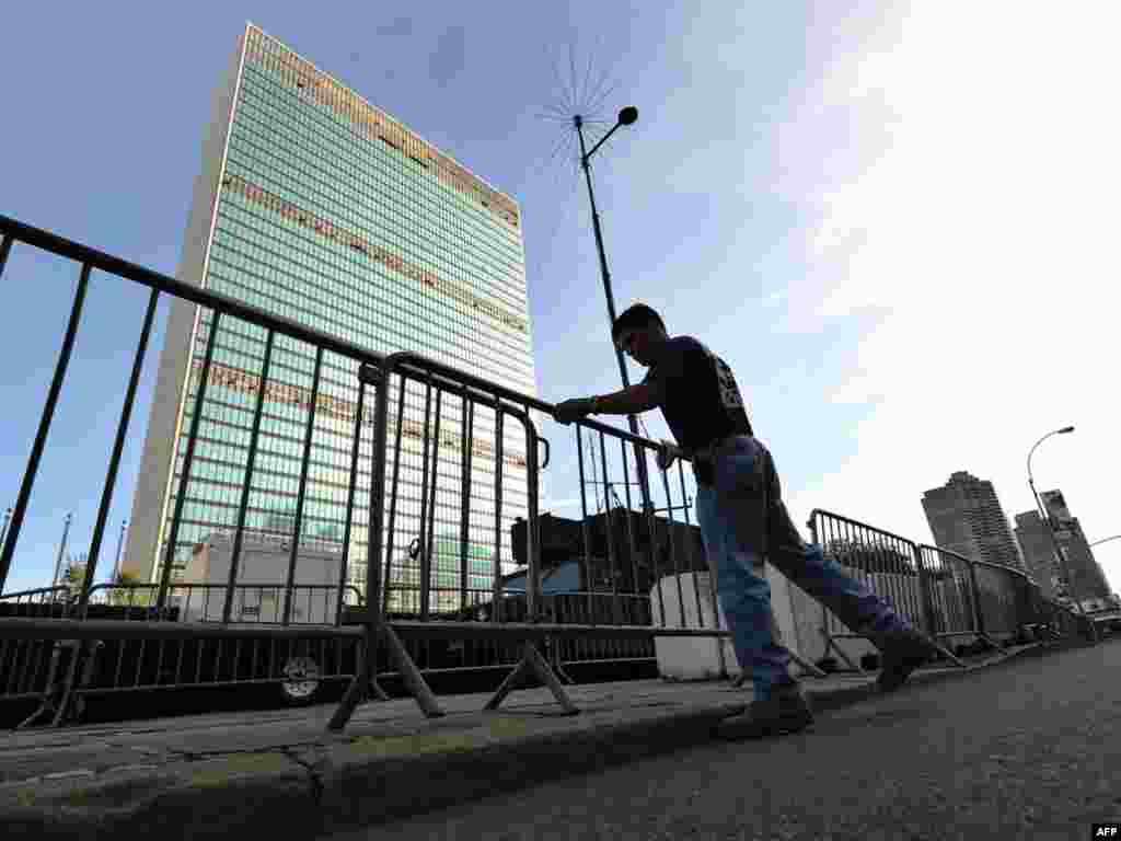 A policeman arranges barricades around the UN building in New York ahead of the 64th UN General Assembly.