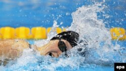 American swimming phenom Katie Ledecky soared into Olympic history, matching a 48-year record for winning freestyle events.