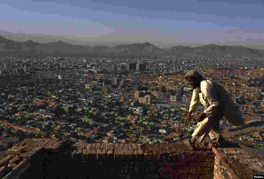 A man works at a construction site at a hilltop in Kabul. (Reuters/Omar Sobhani)