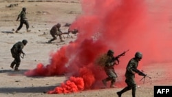 In October Afghan National Army soldiers participate in a combat training exercise at the Afghan National Military Training Center.