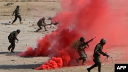 FILE: Afghan National Army (ANA) soldiers participate in a combat training exercise at the Afghan National Military training center (KMTC) in Kabul.