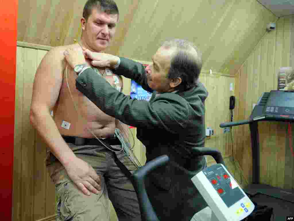 Backup Mikhail Sinelnikov undergoes medical checks before the experiment began.