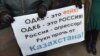 Плакат учасників акції протесту біля парламенту Киргизстану проти відправки до Казахстану киргизьких військових в рамках Організації договору про колективну безпеку (ОДКБ). Бішкек, 7 січня 2022 року 