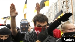 Ultranationalists gesture during the "Russian March" demonstration on National Unity Day in Moscow