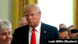 U.S. --U.S. President Donald Trump departs after awarding a Medal of Honor posthumously to Air Force Technical Sergeant John A. Chapman in the East Room at the White House in Washington, U.S., August 22, 2018