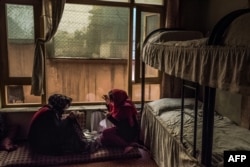 Afghan women sew in their bedroom at a women's shelter in Kabul (file photo)