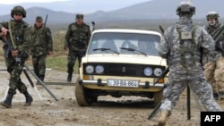 U.S. and Azerbaijani soldiers participate in a joint NATO military exercise outside Baku in April 2009.