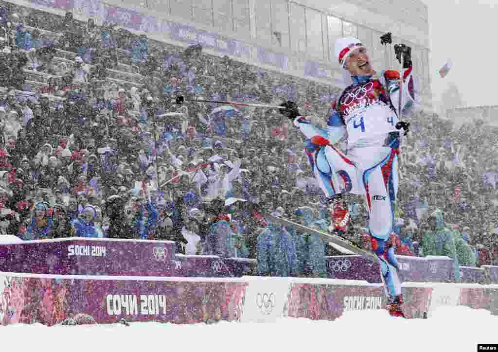 The Czech Republic's Ondrej Moravec celebrates after crossing the finish line for the bronze medal in the men's 15-kilometer mass-start biathlon. (Reuters/Carlos Barria)