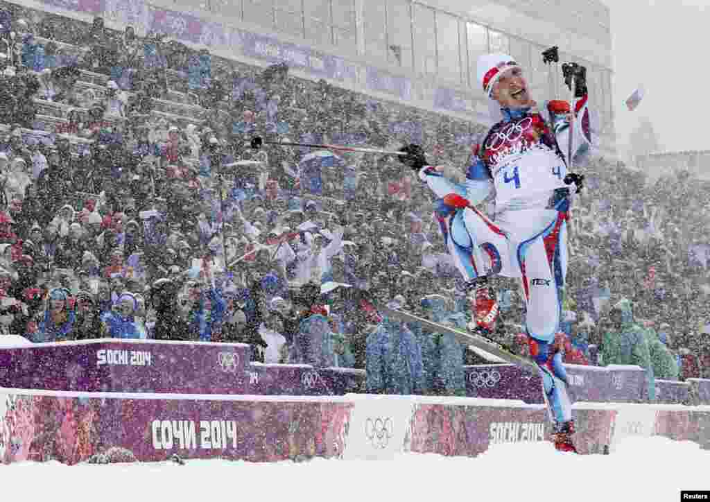 The Czech Republic&#39;s Ondrej Moravec celebrates after crossing the finish line for the bronze medal in the men&#39;s 15-kilometer mass-start biathlon. (Reuters/Carlos Barria)