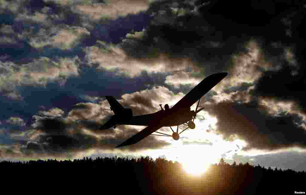 Locksmith Frantisek Hadrava pilots Vampira, an ultralight plane near the village of Zdikov, Czech Republic. Hadrava spent two years building the plane so he could fly to work and cut down on his commuting time. (Reuters/David W. Cerny)