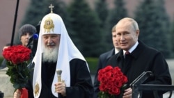 Russian President Vladimir Putin and Patriarch Kirill lay flowers at the monument on the Red Square near the Kremlin, marking National Unity Day in Moscow on November 4, 2018.