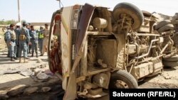 A minivan lies ruined at the site of a roadside bombing in Kabul on August 7.