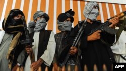 It is hoped that the release of Mullah Abdul Ghani Baradar could help ensure that more Taliban fighters like these men put down their guns. (file photo)