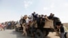 Добровольцы, участвующие в операции иракской армии против боевиков, захвативших Мосул и другие северные районы Ирака, июнь 2014