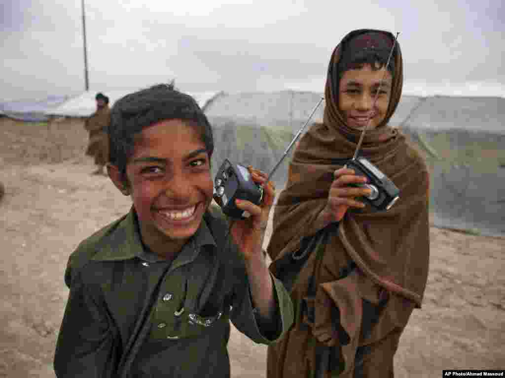 The radio distribution drive began on September 17 in a camp for internally displaced people on the outskirts of Kabul. These two boys were among the first to receive one of the 20,000 radios RFE's Afghan service Radio Azadi has since been distributing across the entire country.