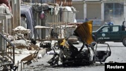 Debris from a car bomb in Kandahar after the clashes