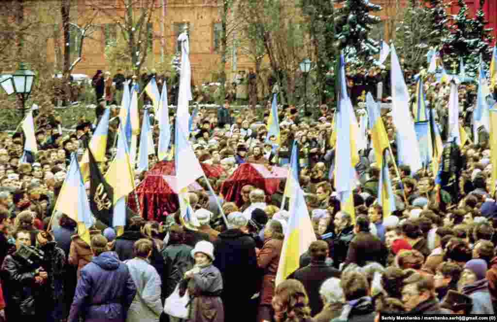 Dissidents paid an especially heavy price, such as Vasyl Stus, Yuriy Lytvyn, and Oleksa Tykhyi, who were reburied (pictured) in Kyiv on November 19, 1989, with the then-banned Ukrainian flag proudly displayed. The three died while serving time for various crimes including &quot;anti-Soviet activity&quot; and &quot;anti-Soviet agitation and propaganda.&quot; &nbsp;