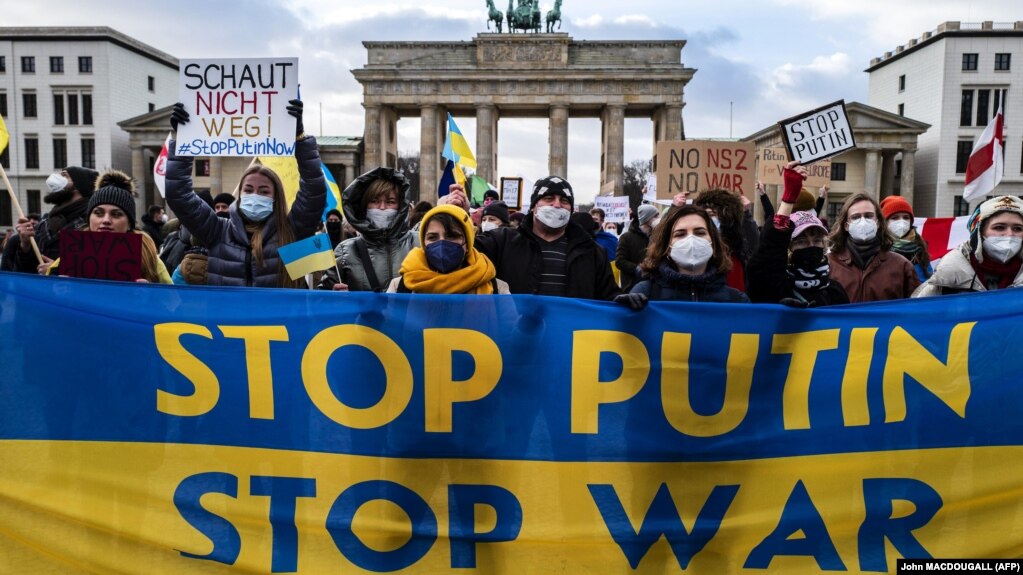 Demonstrators rally during a protest at Berlin's Brandenburg Gate on January 30.