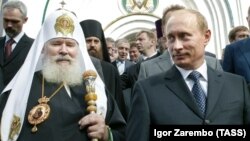 Патріарх РПЦ Алєксій II і президент Росії Володимир Путін. Росія, 10 вересня 2006 року