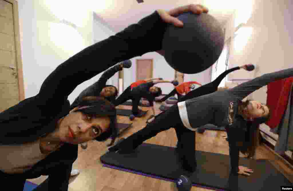 Pilates instructor Zainab Abbas (left) leads a class at her fitness studio in Lahore. Abbas opened her fitness studio, Route2Pilates, after receiving training in Bangkok, Thailand. She provides rehabilitation workouts for people with joint problems and specialised workouts for pregnant women.