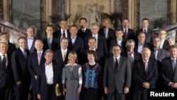 EU High Representative for Foreign Affairs and Security Policy Catherine Ashton (bottom, center) poses for a family photo with European Union foreign affairs ministers on the first day of an informal meeting at the Egmont Palace in Brussels on September 1