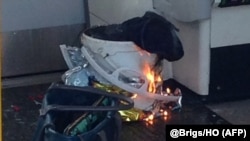 A white container burns inside a London Underground subway carriage in London on September 15.