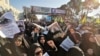 Iranian mourners gather for the burial of slain top general Qasem Soleimani in his hometown Kerman on January 7.