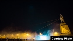 A crowd demolishes a statue of the Soviet leader Vladimir Lenin in Kharkiv. Scores of Lenin statues were pulled down in Ukraine in 2015 but hundreds more are still standing.