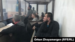 "Террорлық ұйымға қатысты" деп айыпталған 14 адамның ісі бойынша сот процесі. Нұр-Сұлтан (қазіргі Астана). 22 қазан, 2019 жыл