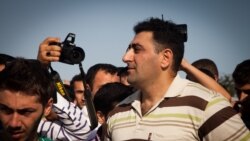 Azerbaijan -- Ramil Safarov, center, receives a hero's welcome in Baku, 31Aug2012.