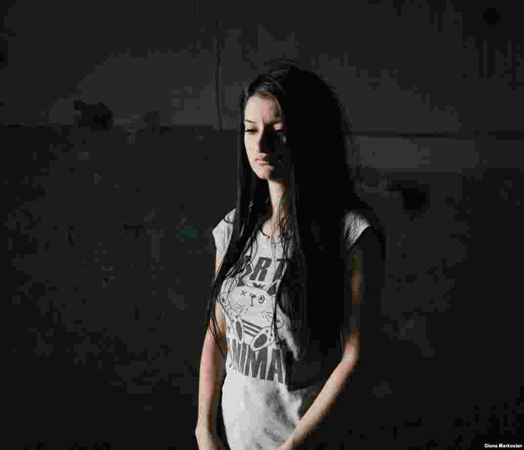 Kristina Dzgoyeva was 11 when she went to the first day of school with her 10-year-old sister, Dzera, and their mother. They stayed close together in the gymnasium after they were taken hostage, but got separated from each other after the explosions on the third day. Kristina and her mother survived, but Dzera died at the school. The family had always lived next to the school, but after the attack, they moved several blocks away. Kristina, pictured here in her old classroom, keeps all of her memories about the siege written down in a diary. Ten years later, she is studying in Moscow and prefers to be far from Beslan. "I don't want anything back here," she says. 