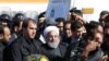 Iranian President Hassan Rohani (C) visits the earthquake-hit area of Sarpol-e Zahab in Iran's western province of Kermanshah, November 14, 2017