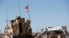 U.S. soldiers near the tense front line between the U.S-backed Syrian Manbij Military Council and the Turkish-backed fighters, in Manbij, north Syria, April 4, 2018