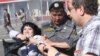 Police detain a participant during demonstrations in Moscow on May 31.