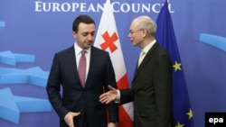 Georgian Prime Minister Irakli Garibashvili (left) with EU Council President Herman Van Rompuy in Brussels on February 4.