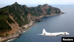 Avion PC3 Japanskih pomorskih snaga samoodbrane leti oko spornih ostrva u Istočnom kineskom moru, poznatih kao ostrva Senkaku u Japanu i Dijaou u Kini, arhivska fotografija