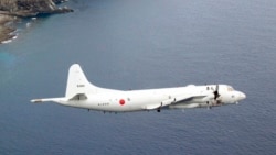 Самолет Lockheed P-3 Orion Морских сил самообороны Японии у спорных островов Сенкаку в Восточно-Китайском море