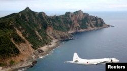 Самолет японских ВВС над спорными островами в Восточно-Китайском море. Иллюстративное фото. 