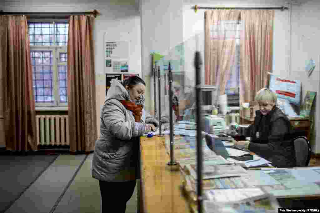 Lidia Dmitrievna Sholicheva visits the local post office, which once employed 13 people