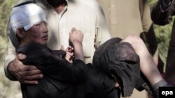 An Afghan boy who was injured in a bomb blast is brought to a hospital in Nangarhar, Afghanistan, in November. The UN says there has been an upsurge in the number of civilians affected by violence in the country.